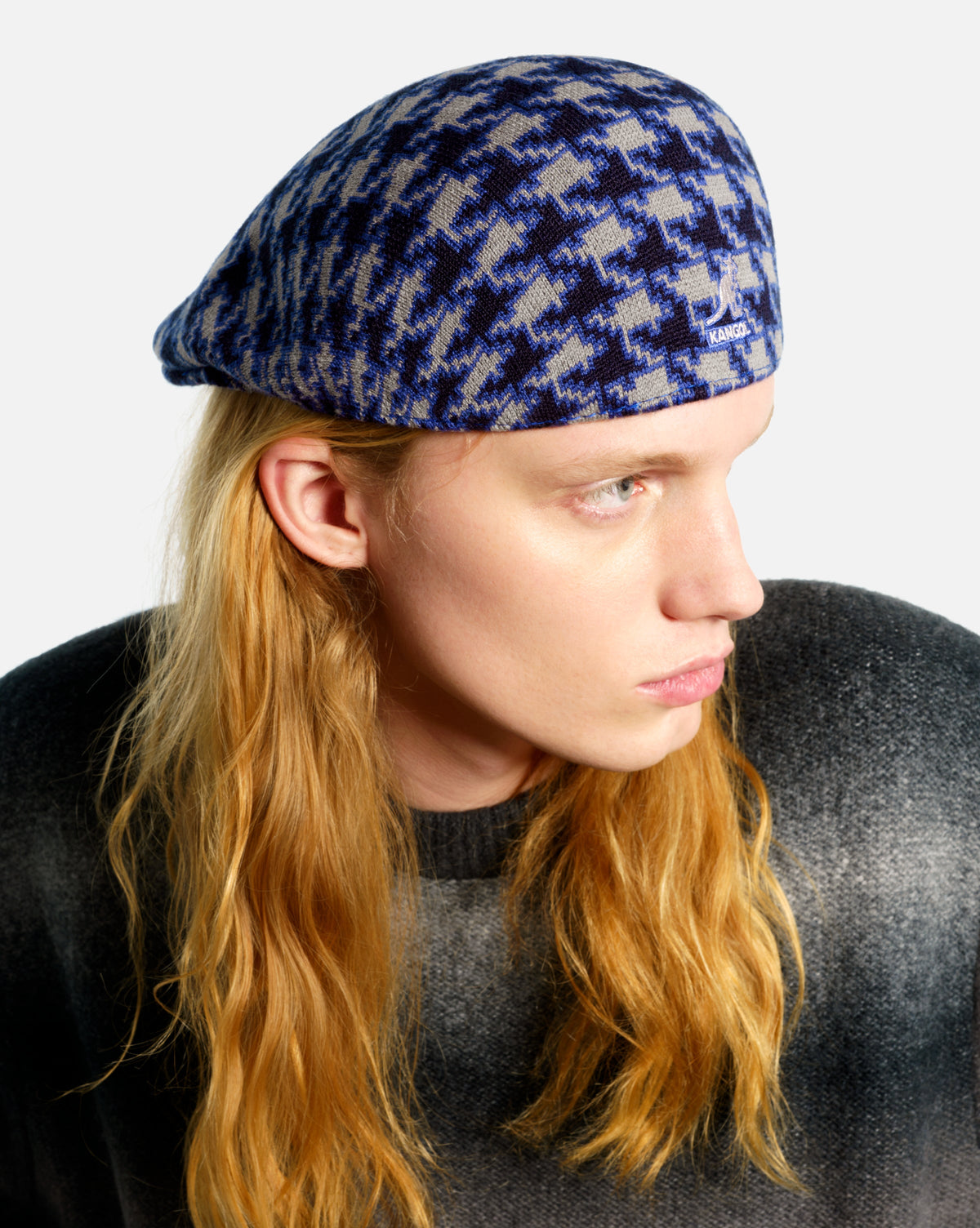 Model wearing the Kangol Houndstooth 507 cap in blue